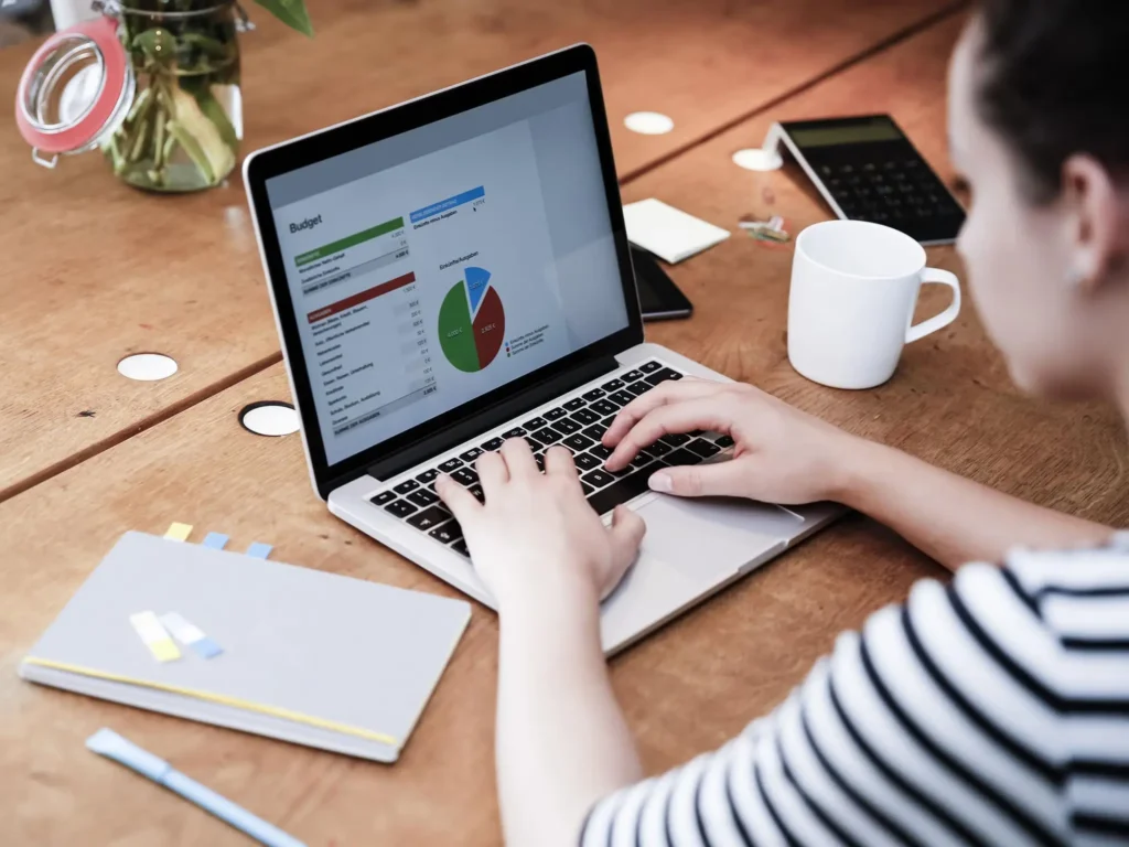 Illustration of a person working on a laptop from home, highlighting 5 ways to start without investment online work and earn from home.