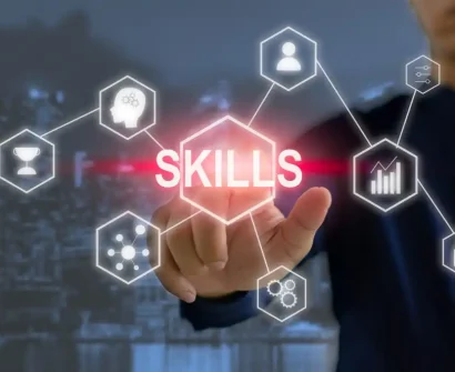 Teacher using a laptop, showcasing essential digital skills for online teaching in 2024.